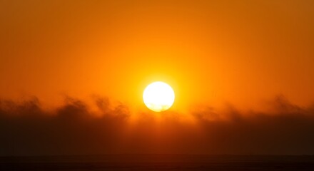 The rich, orange glow of the sun through dust.