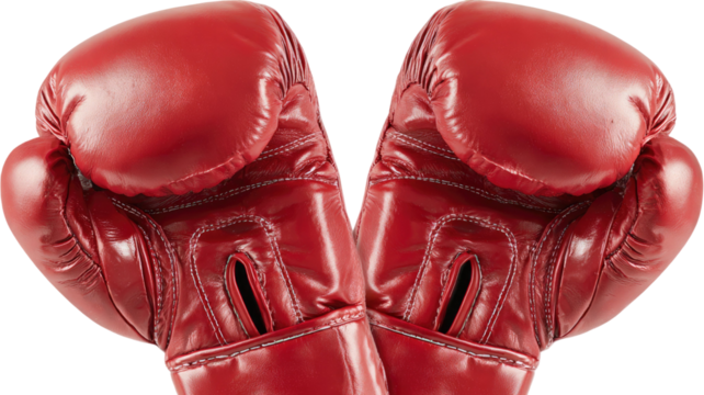 Pair of red boxing gloves with padded leather surface and athletic training detail for combat sports isolated on white background.