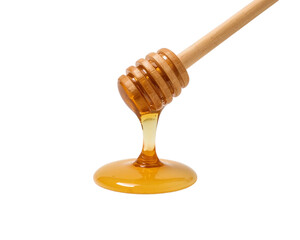 Sweet golden honey drips from a wooden dipper creating a puddle