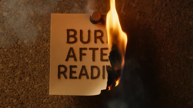 Burn after reading note warning charred paper pinned to corkboard with smoke and small flame conveying secrecy urgency and danger