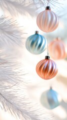 Beautifully arranged pastel ornaments hanging on a white Christmas tree with soft, blurred background lights