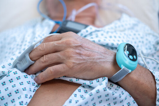 elderly man with sleep apnea monitoring device and fingertip pulse oximeter, senior male patient health tracker, adolescent sleep study equipment, breathing disorder research concept - Powered by Adobe