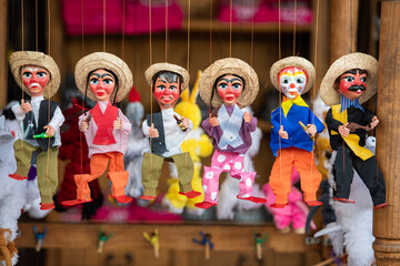 Spanish-style puppets are displayed in a store.