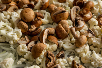 Raw Cauliflower, Mushrooms, and Onion on Tray – Seasoned and Ready to Roast