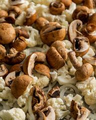 Raw Cauliflower, Mushrooms, and Onion on Tray – Seasoned and Ready to Roast