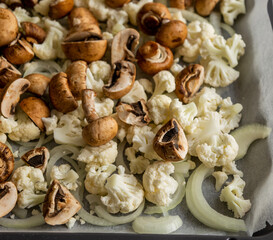 Raw Cauliflower, Mushrooms, and Onion on Tray – Seasoned and Ready to Roast