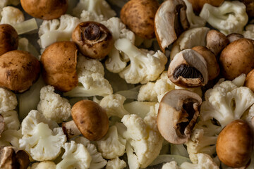 Raw Cauliflower, Mushrooms, and Onion on Tray – Seasoned and Ready to Roast