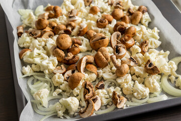 Raw Cauliflower, Mushrooms, and Onion on Tray – Seasoned and Ready to Roast