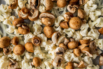 Raw Cauliflower, Mushrooms, and Onion on Tray – Seasoned and Ready to Roast