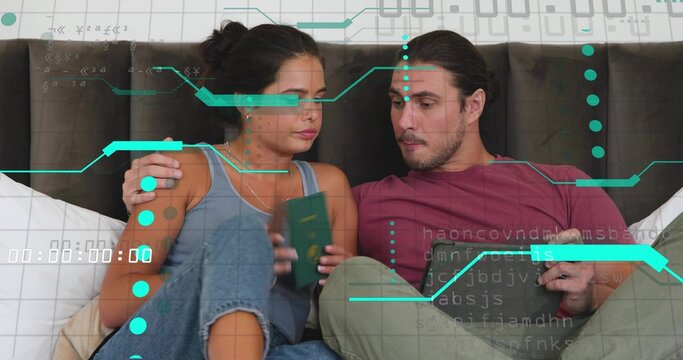 Holding green passport woman left leaning on dark headboard, man right checking tablet, teal holo