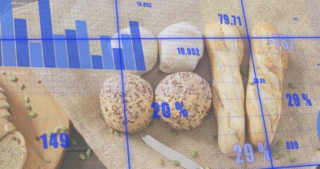 Displaying seeded rolls and baguettes grouped on wood table with garlic and blue chart overlay