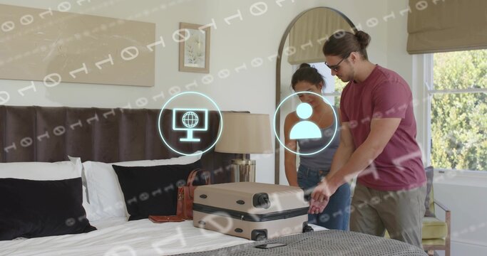 Packing couple in casual wear handling beige suitcase in hotel room, digital overlay, copy space - Powered by Adobe
