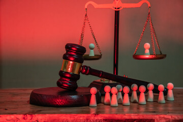 On the judge's scales, each bowl contains a human figure, and next to it, a line of other figures people awaiting trial. Social justice, comparison, inequality, judgment, public condemnation, reprisal