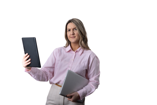 Businesswoman looking confused at tablet and laptop - Powered by Adobe