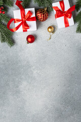 Christmas present, balls and fir tree branches.