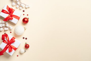 Christmas present, balls and fir tree branches.