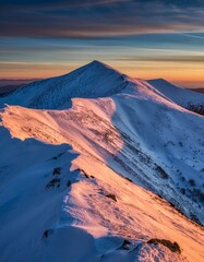 Majestic Snow-Capped Mountain Peak at Sunset in Scenic Landscape