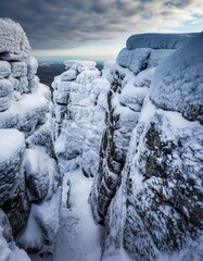 Majestic Winter Landscape with Ice-Covered Rocks and Snowy Canyon