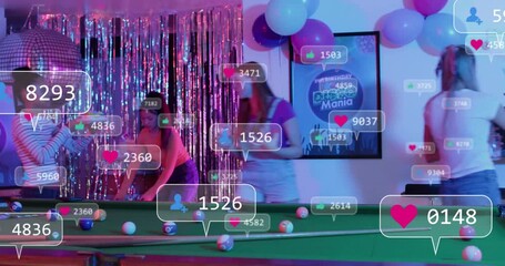 Four women arranging disco props by pool, tapping phone and driving overlay hearts for likes