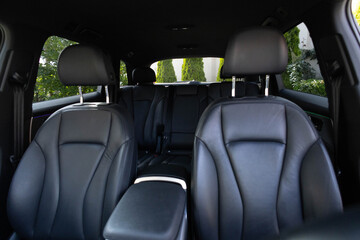 Luxury car leather seats. Interior of new modern clean expensive car. Passenger seats with leather. Closeup details. New car inside. Car cleaning theme