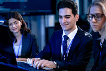 Code compiled success. Smiling developer celebrates breakthrough with team late night coding session solving complex bug collaborative tech win achievement unlocked.