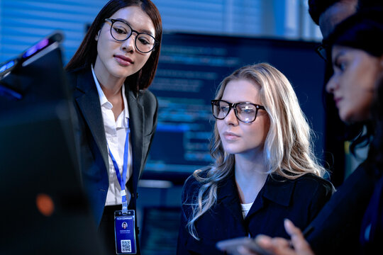 Team success unlocked. Smiling professionals collaborate hitting project goals late night modern tech hub positive workflow diverse colleagues focused together.