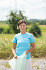Portrait caucasian woman, volunteer and smile with eco friend. green and waste management. Cleaning, charity community service event, ngo business and outreach, Group Diverse people meeting at park