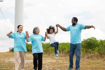 Volunteers are walking behind a windmill farm, volunteer charity people. charity community service event, ngo business and outreach, Group Diverse people meeting at park for donation