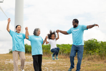 Volunteers are walking behind a windmill farm, volunteer charity people. charity community service event, ngo business and outreach, Group Diverse people meeting at park for donation
