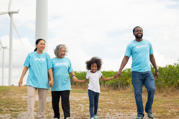 Volunteers are walking behind a windmill farm, volunteer charity people. charity community service event, ngo business and outreach, Group Diverse people meeting at park for donation