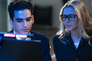 Onboarding future skills now. Experienced lead guides new talent navigating complex AI interface screen shows advanced data streams accelerated learning immersive tech hub build mode activated go.