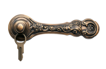 Ornate antique brass door handle with a vintage key inserted