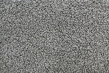 Close-up background of a warp fabric with an abstract pattern in gray.