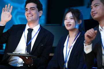 A diverse tech team discusses a new digital strategy. An Indian manager uses a tablet to show AI driven analytics for sustainable ESG growth to a colleague.