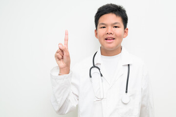 Young Asian Boy Dressed as Doctor with Stethoscope Pointing Finger Gesture Direction Indicating