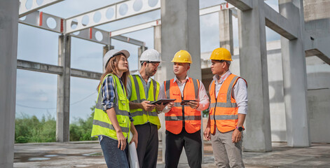 Team of construction engineers and architects discussing blueprint and project details at building site, showcasing teamwork, engineering, infrastructure development, and site planning.