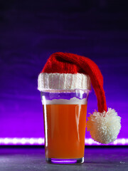 Craft beer in a Christmas hat , copy space