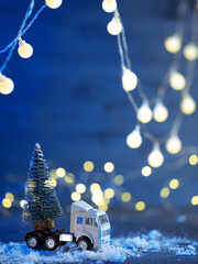 Truck with a Christmas tree in the back , holiday card
