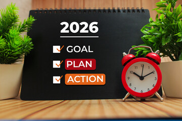 2026 goal plan action written on notebook on office desk for strategy concept.