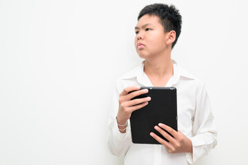 Asian Teenage Boy Student Portrait on White Background Using Digital Tablet Computer Thinking