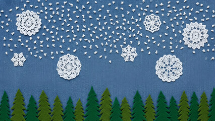 Whimsical illustration of large white paper snowflakes falling gently against a dark blue starry night sky above a silhouette of green pine trees
