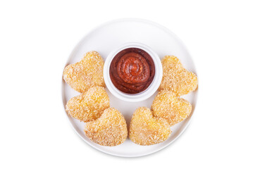 Potato croquette in the form of hearts with ketchup sauce for Valentine's day holidays on a white...