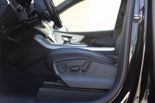 Driver's seat adjustment buttons. Buttons for adjusting seat position. Car interior. Furniture Adjustment Button Activated Power Seat Expensive Black Leather