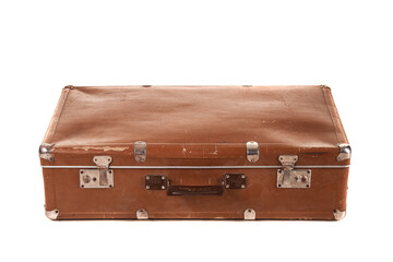 A vintage brown suitcase shows signs of wear with scuffed edges and a sturdy handle. It rests on a neutral surface, appealing to those who appreciate classic travel gear