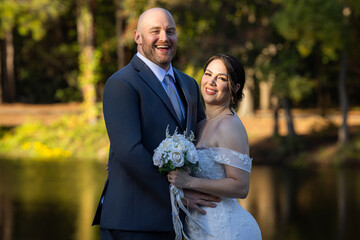 A heartfelt and elegant wedding portrait featuring a beautiful couple (bride and groom) celebrating their marriage.