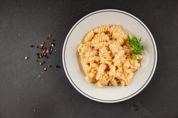 Carbonara pasta fusilli creamy sauce main course Italian cuisine tasty snack fresh delicious gourmet food background on table rustic food top view copy space