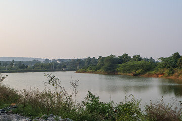 Beautiful water canal surrounded with green. Canal or water crossing, nature landscape.