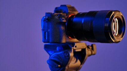 Professional DSLR Camera on Tripod in Blue Light