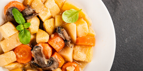 Potato stew mushrooms and vegetables natural tasty snack fresh delicious gourmet food background on the table rustic top view copy space keto and paleo diet vegerian and vegan food