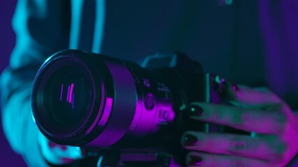 Close up of Camera Lens in Neon Lighting - Powered by Adobe